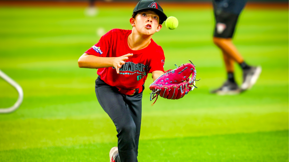 Young catcher preparing to receive the pitch