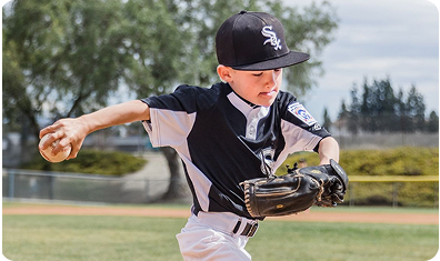 Little league player making a throw